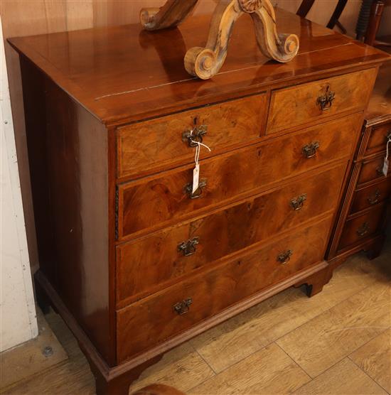 A Georgian style walnut chest of five drawers W.97cm